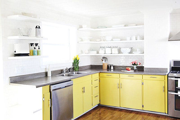 Sunny yellow cabinets in a crisp white kitchen