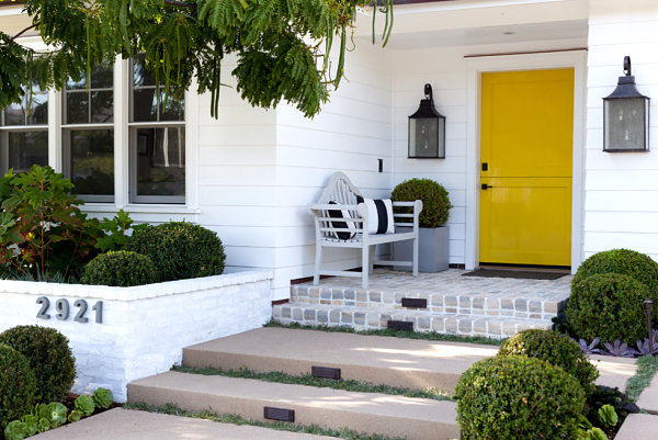 Wooden bench near a painted front door