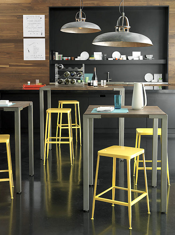Yellow barstools in a charcoal space