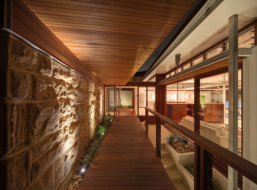 large stone wall and a wooden walkway