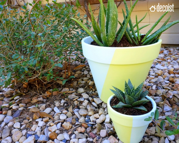 These painted geometric pots look great inside our outdoors