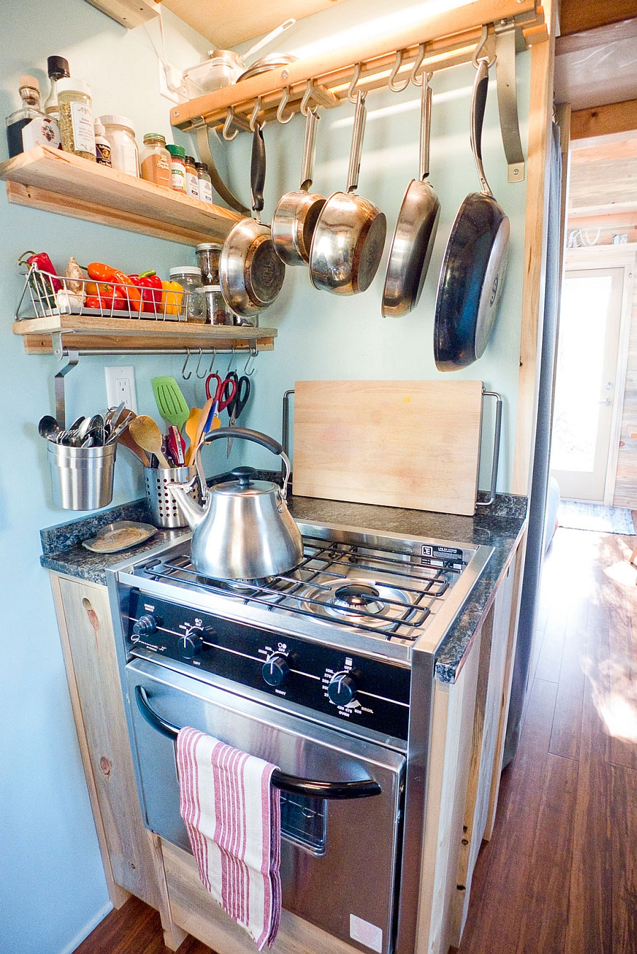 A pot rack saves up space in compact kitchens