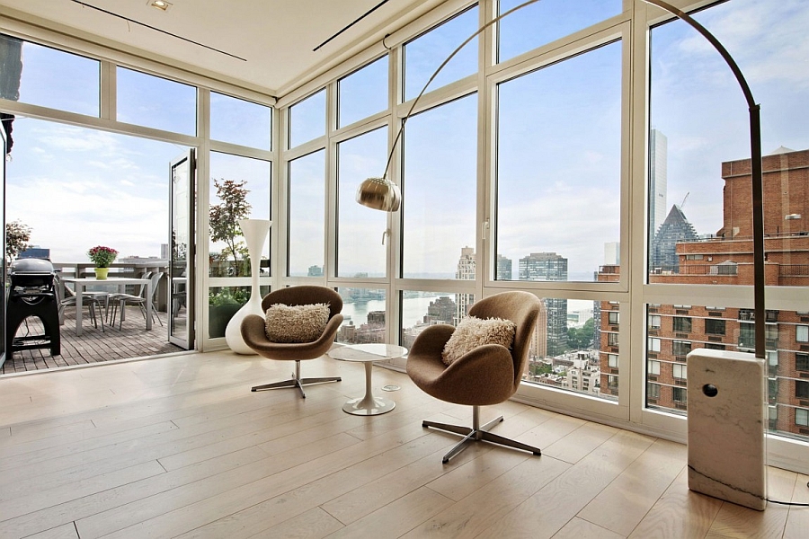 Arco floor lamp and swan chairs in the living room of NYC apartment