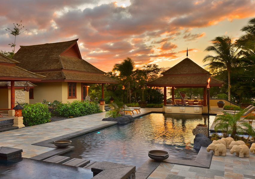 Balinese backyard pool and tribal bungalows