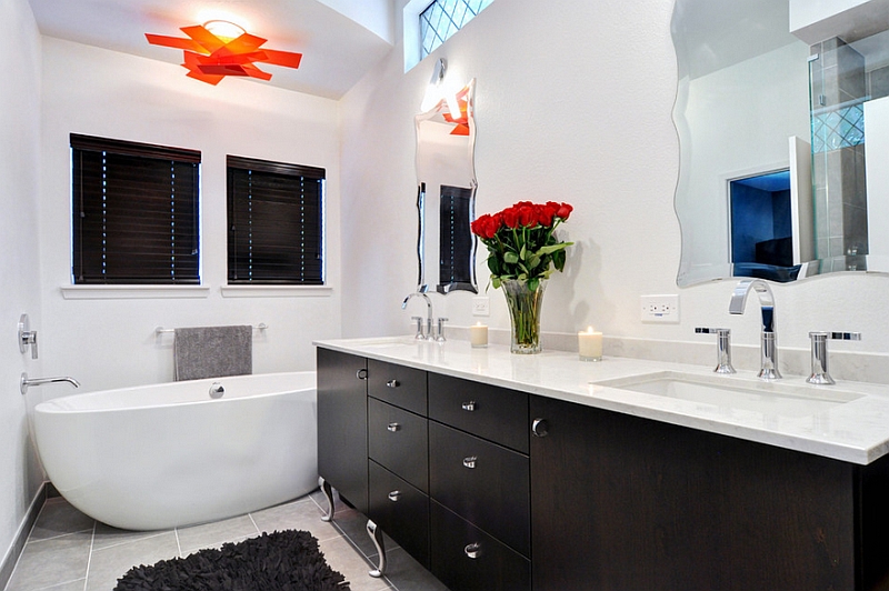 Black and white master bath with pops of red