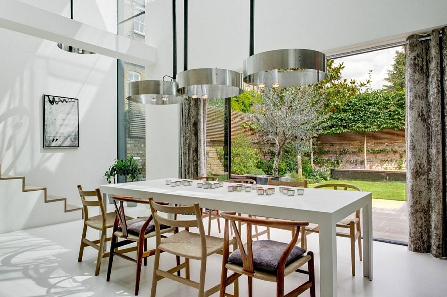 Elegant dining area visually connected to the backyard