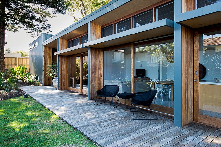 Glass windows open up the interior to the backyard