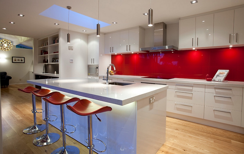 Glossy back-painted glass backsplashes in red are both popular and trendy