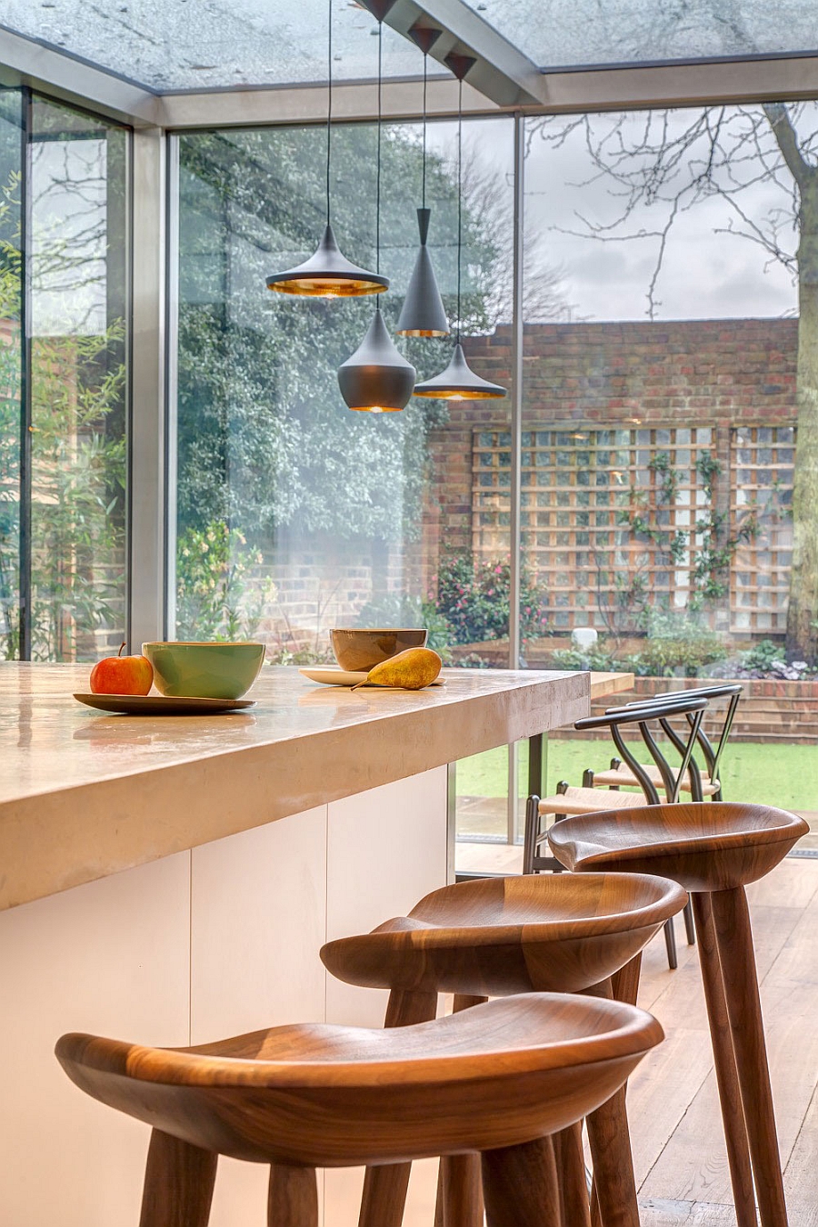 Kitchen and dining areas visually connected with the backyard