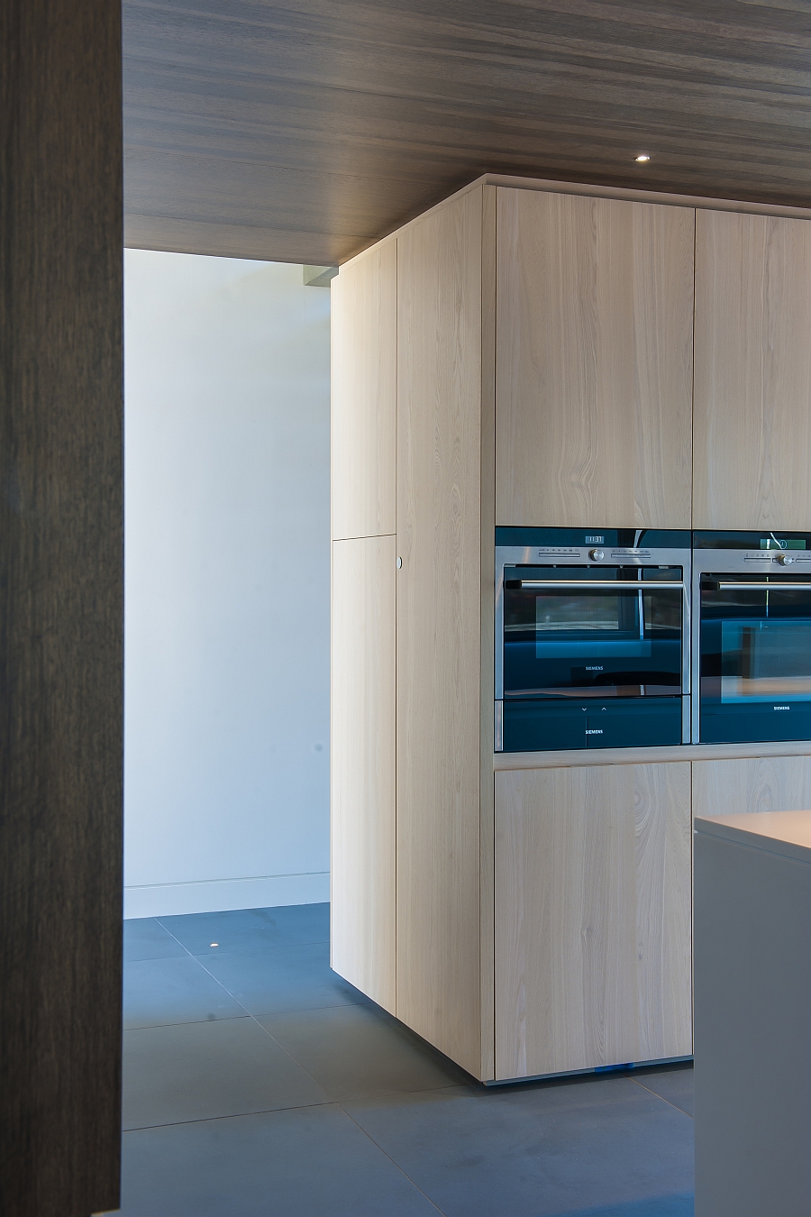 Kitchen appliances along with concealed shelves