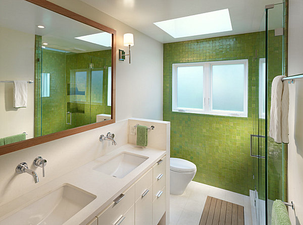 Modern bathroom with green tile and towels