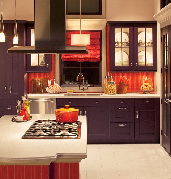 Orange subway tile makes up the backsplash in this kitchen