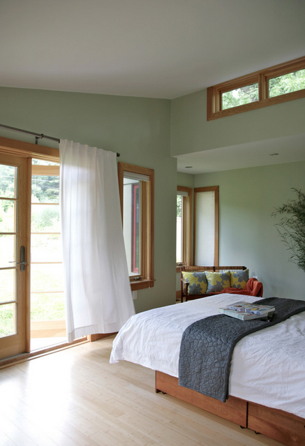 Peacefully designed bedroom with green walls