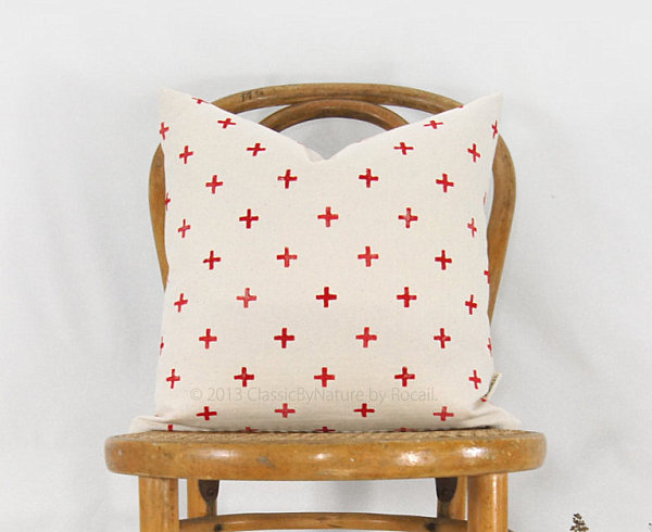 Pillow with a red cross motif