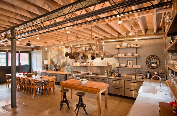 Shiny stainless steel cabinets blend in with the industrial theme