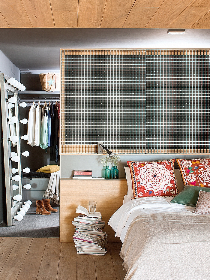 Sleek bedside table and sconce lighting