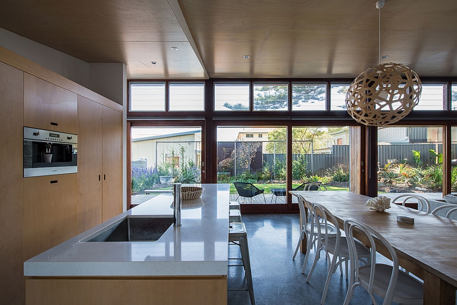 Sleek modern kitchen with island countertop in white