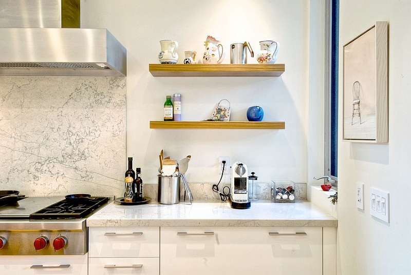 Sleek wood shelves set next to the marble backsplash