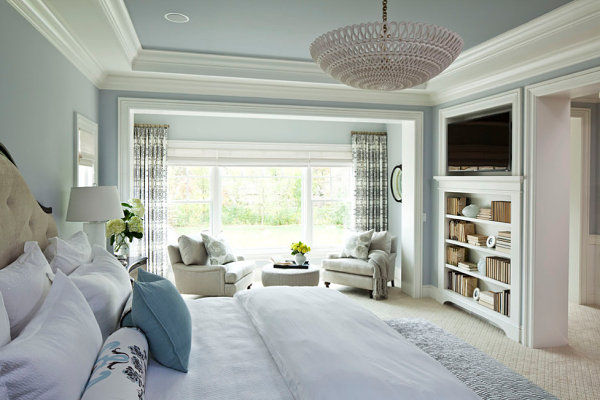 Statement chandelier in a bright bedroom