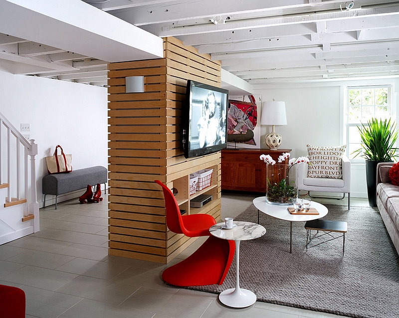 Stylish basement family room filled with mid-century modern decor