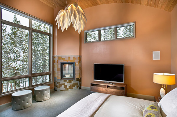 Stylish master bedroom with porcelain suspension lamp