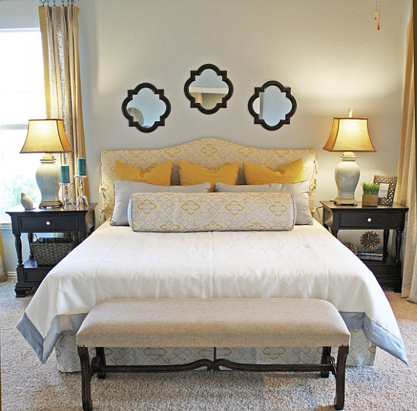 Table lamps accentuate the golden yellow shades in the bedroom