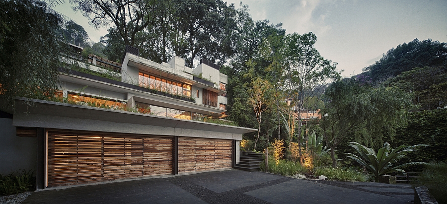 Terraced gardens and greenery surround the house