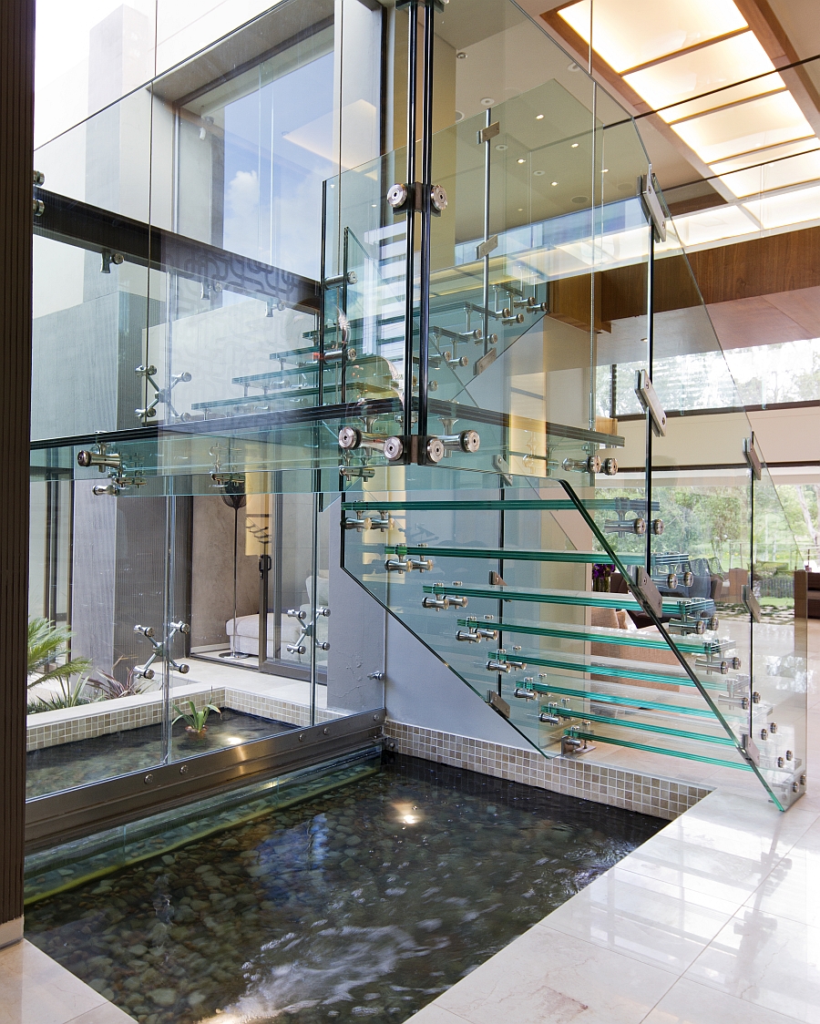 Transparent staircase design lends airiness to the space