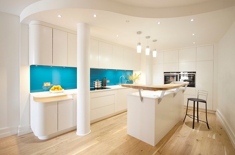 Turquoise back-painted glass backsplash steals the show here!