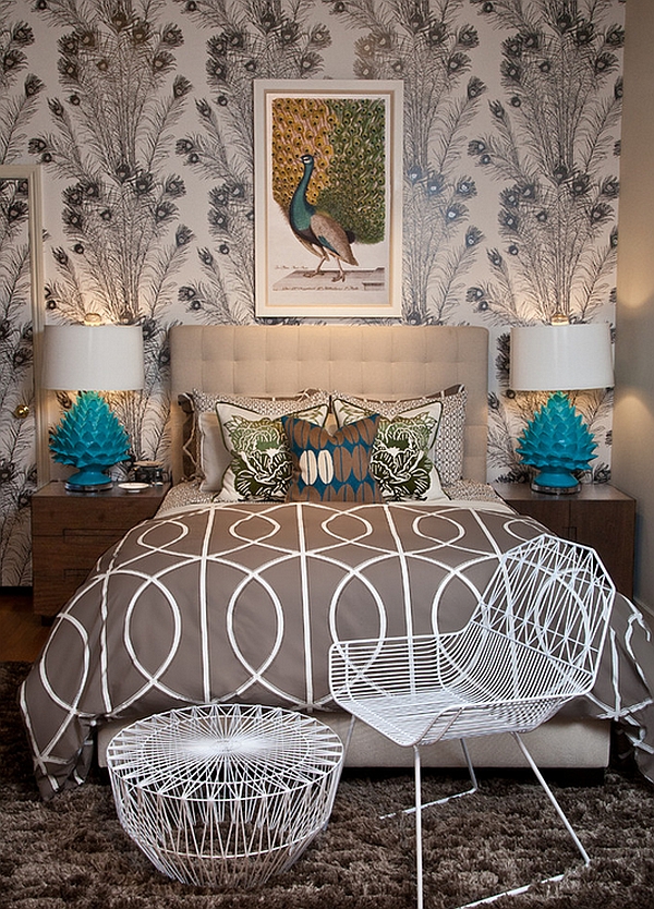 Turquoise lamps blend in with the feathery theme of the room