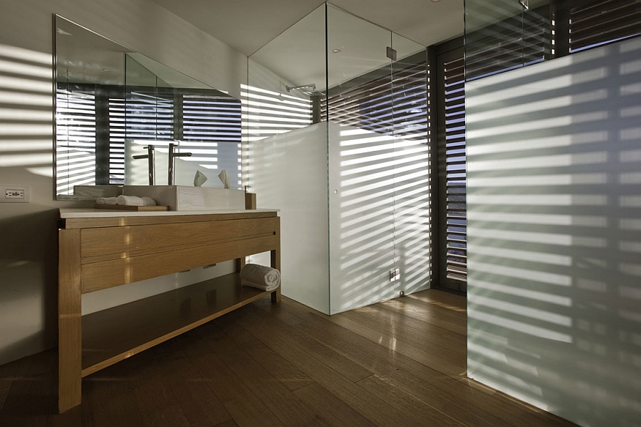 Wooden vanity and glass shower cubicle