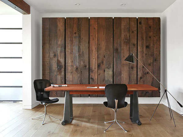 Wooden wall art conceals a murphy bed