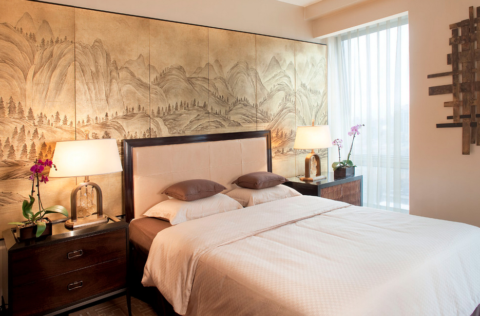 Zen-inspired bedroom with landscape art