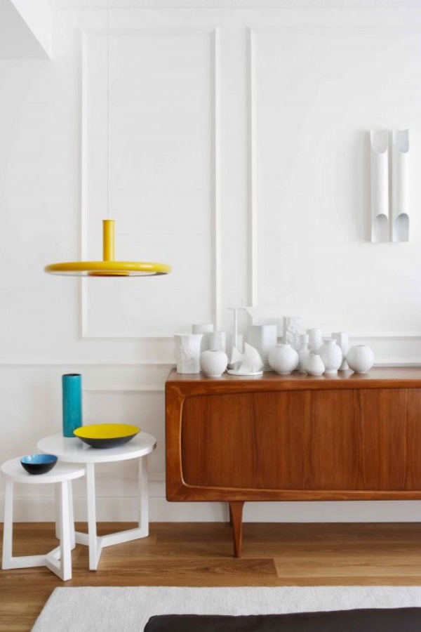 Display of white vases on the teak sideboard