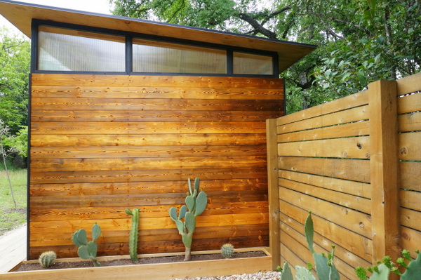 A tiny house and a cedar fence