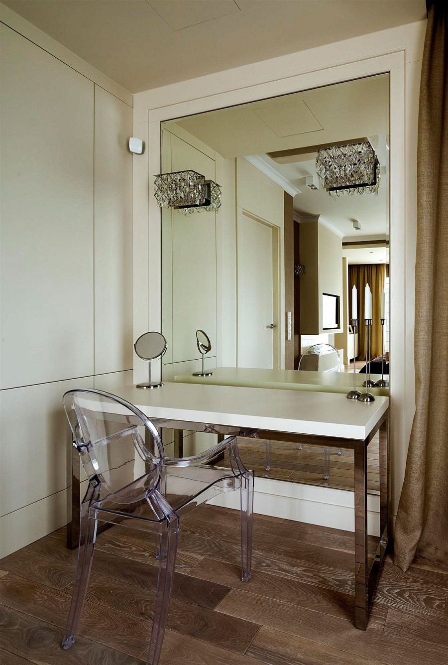 Acrylic chairs and wall sconces for visually airy interiors