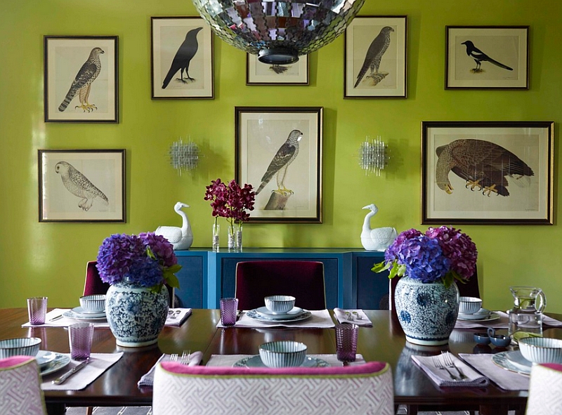 Antique Swedish bird prints set in a dining room with bold color