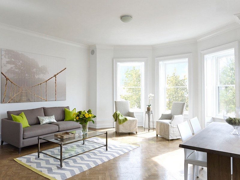 Beautiful living roomw ith herringbone floors and a chevron rug!