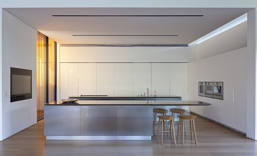 Beautiful modern kitchen in white with an extended serving area