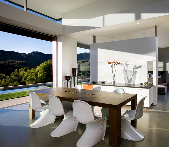 Classic Panton chairs and the view outside lend elegance to the dining room