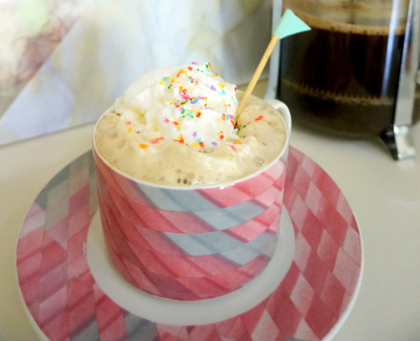 Coffee with whipped cream and sprinkles