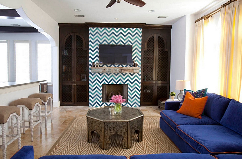 Eclectic living room with bold zigzag tile around the fireplace