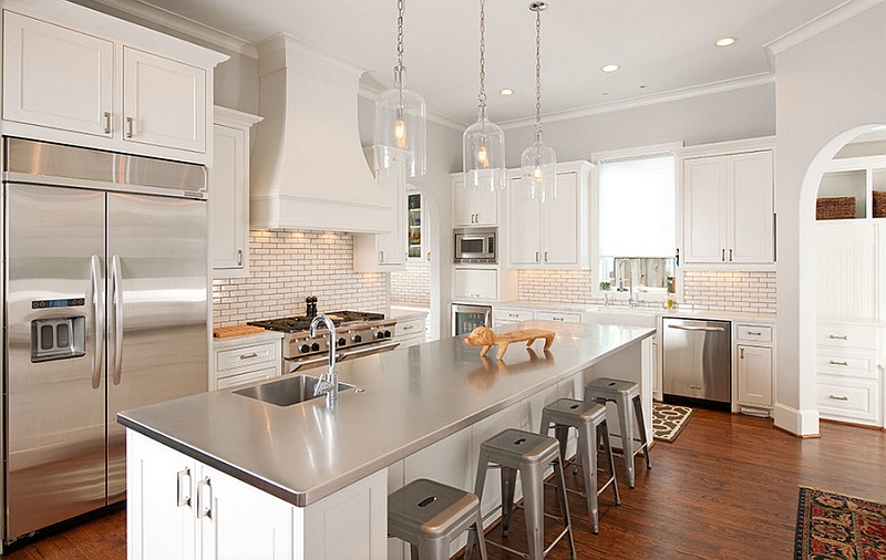 Elegant kitchen in white with a modern stainless steel island