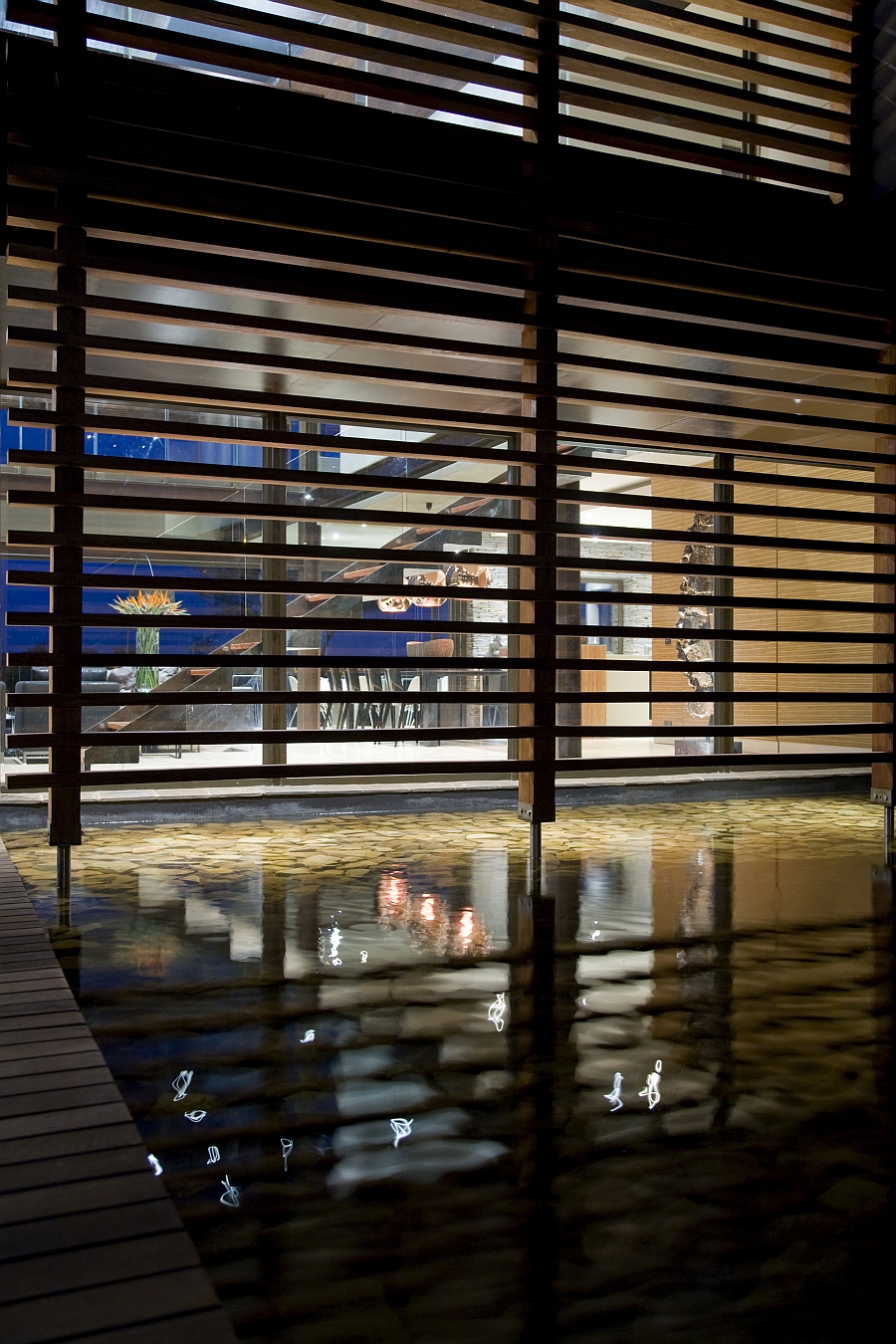 Entryway flanked by a lovely koi pond