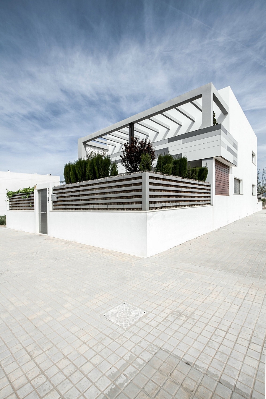 Exterior of the contemporary Spanish home in white