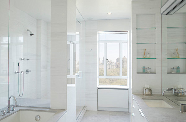 Glass shelving in a light and airy bathroom