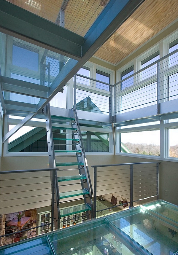 Glass staircase leading to the glass tower on the top level