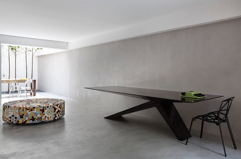 Gorgeous minimalist dining space with a sleek black table