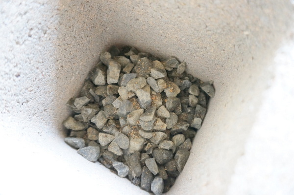 Gravel in the bottom of a cinder block