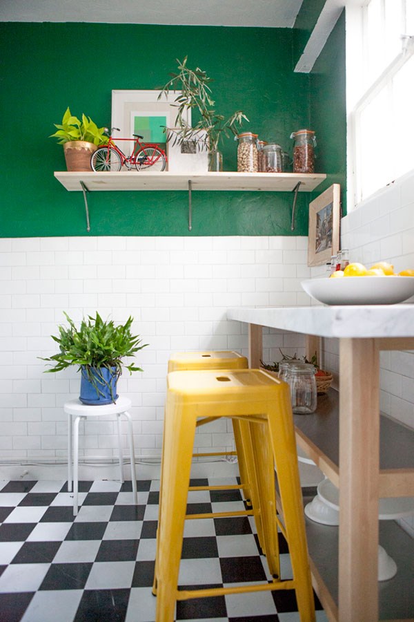 Green kitchen with yellow accents